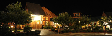 An exterior nighttime shot of the Inn at Glenora Wine Cellars