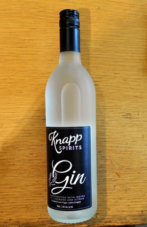 A bottle of Knapp Gin, with frosted glass and a black label.